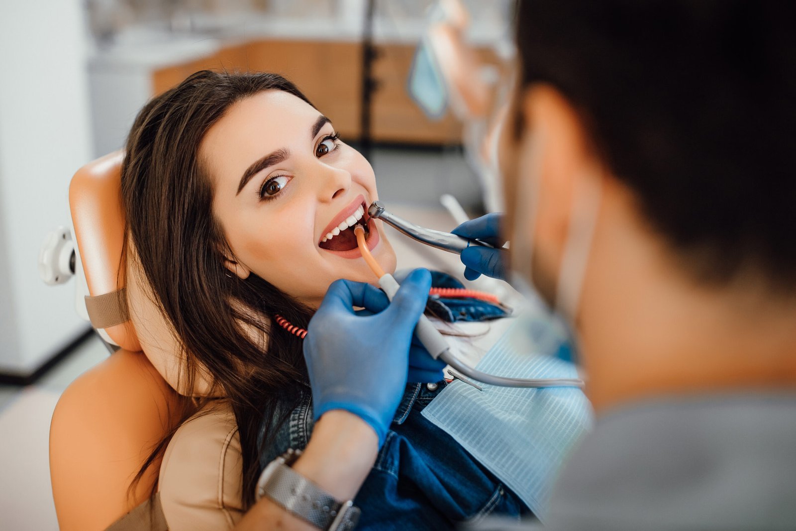 young female patient visiting dentist office scaled