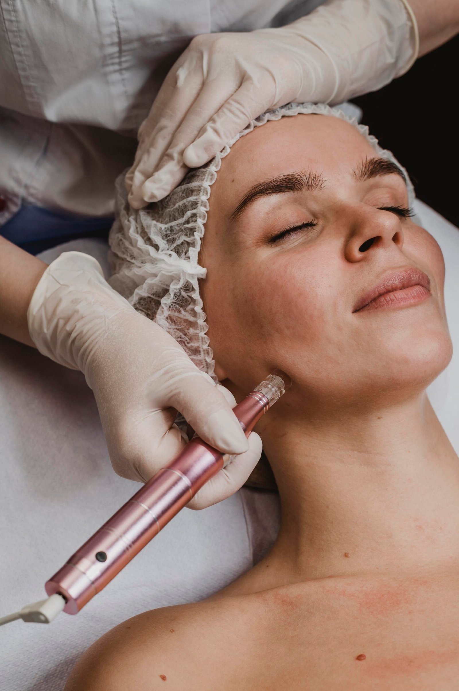 beautiful woman wellness center having cosmetic treatment scaled
