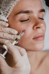 woman getting facial beauty treatment wellness center scaled