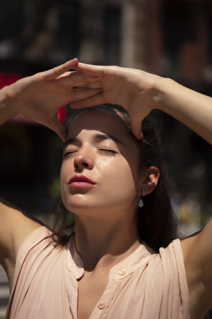 young woman tolerating heat wave outdoors min scaled