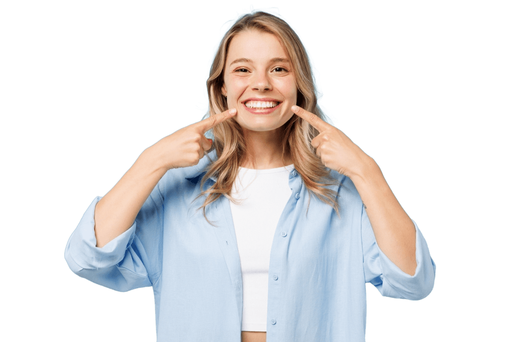 Smiling woman pointing to her bright teeth after cosmetic dentistry treatment